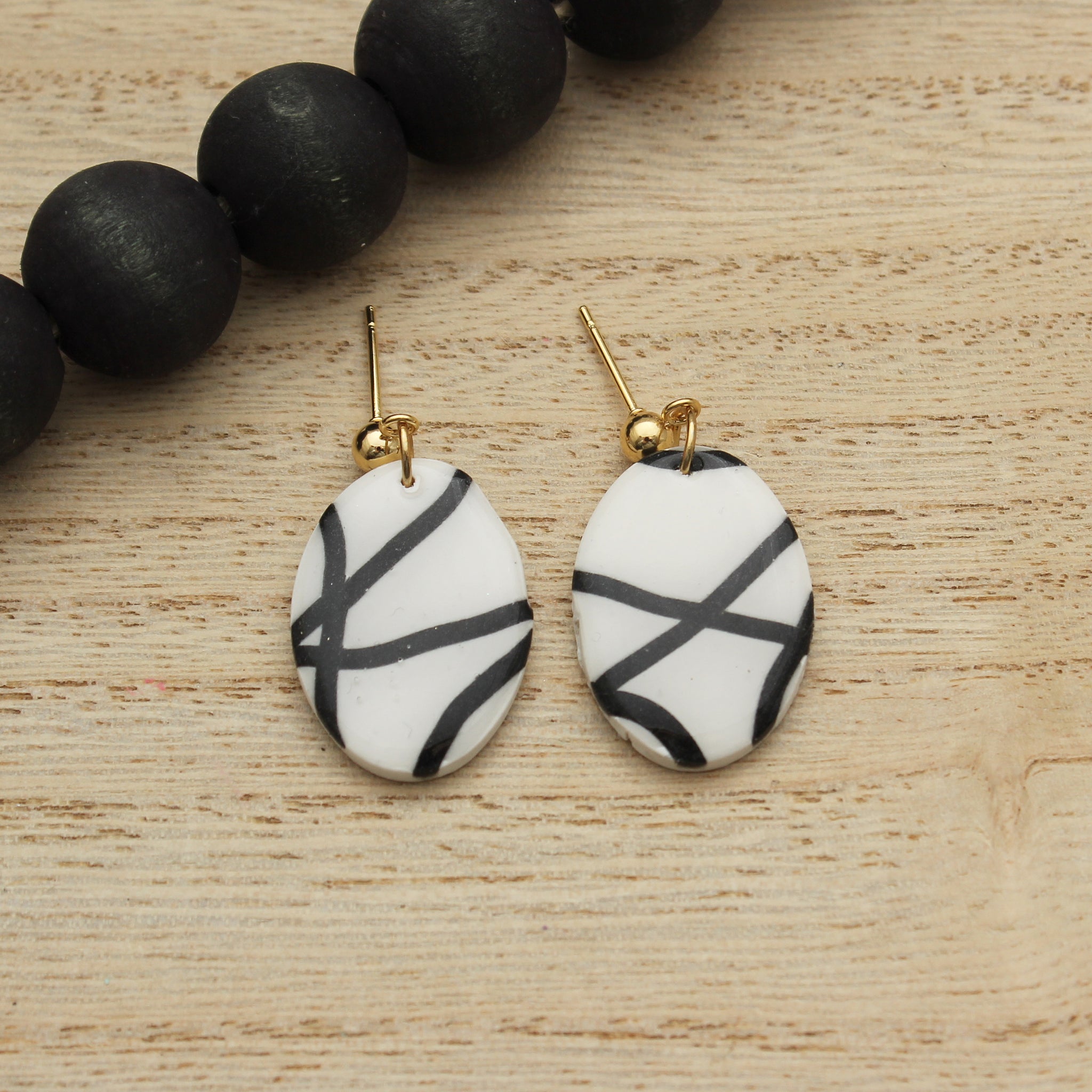 White and Black Squiggle Oval Dangle Earrings
